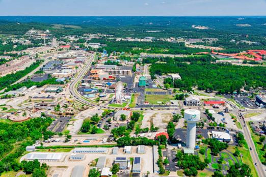 daytime summer aerial view of hwy 76 strip in branson, missouri - branson strip stock pictures, royalty-free photos & images