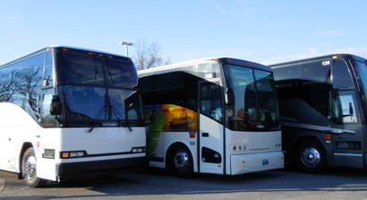 Lineup of modern motorcoach buses parked and ready for departure, representing reliable, organized transportation for schools and large groups, operating under clearly defined Branson Country Tours policies.