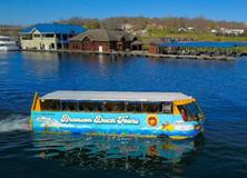 Duck-style tour boat cruising across the scenic Lake Taneycomo