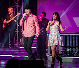 Clay & Tina Cooper singing and dancing in their show, the Clay Cooper Country Music Express Show, which is one of the best shows in Branson.