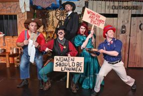 The Branson Murder Mystery cast in period costumes acting out a comedic stage scene with props and signs, engaging the audience through theatrical storytelling and audience participation.