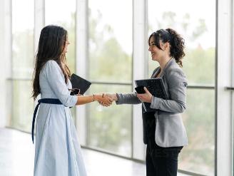 We love working with travel agents!

Picture: two co-workers shaking hands.
