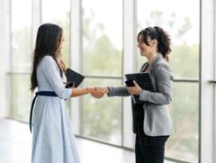 We love working with travel agents!

Picture: two co-workers shaking hands.