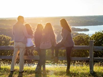 At Top of the Rock, family watching sunset overlooking Table Rock Lake.