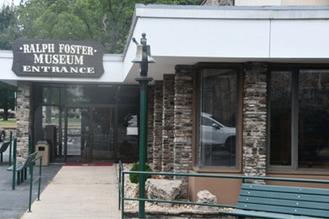 Ralph Foster Museum entrance with rustic wood fa�ade and signage, representing educational culture in Branson MO.